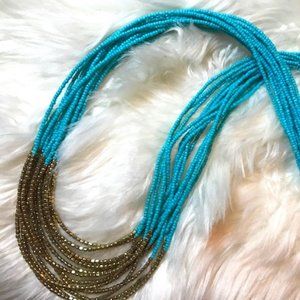 Blue and gold bead necklace